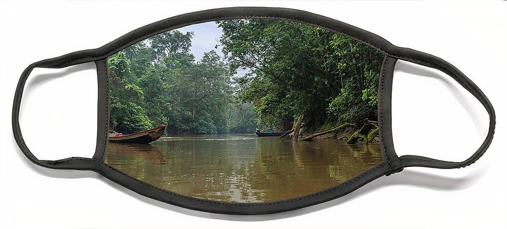 Amazon Face Mask featuring the photograph Amazonian tropical rainforest environment with calm river and canoe by Henri Leduc