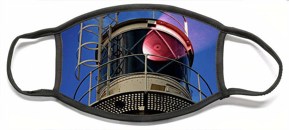 Lighthouse Face Mask featuring the photograph Beam of light from a lighthouse. by Bernhard Schaffer