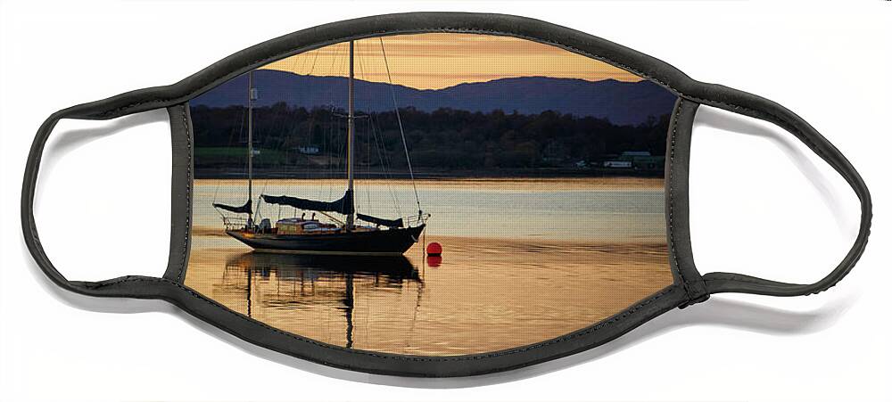 Blue Face Mask featuring the photograph Boat On A Lake at Sunset by Rick Deacon
