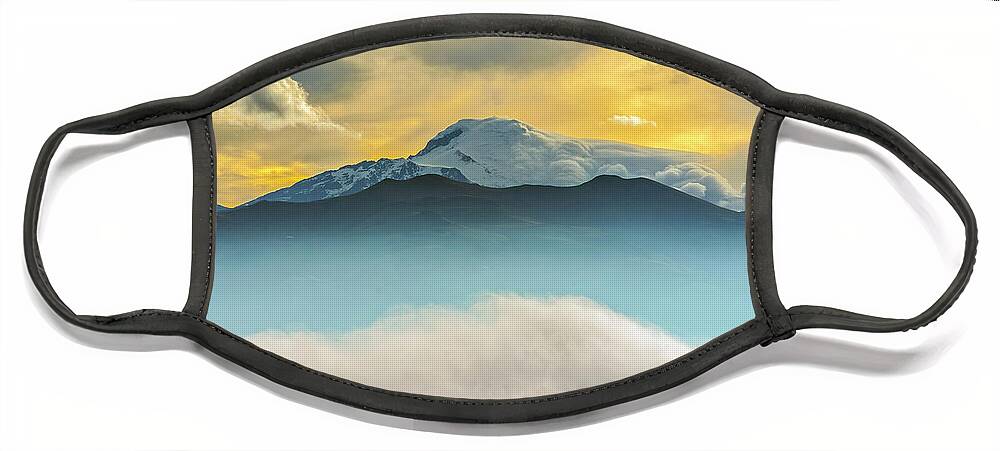 Andes Face Mask featuring the photograph Cloud bank and sunrise on the Cayambe volcano by Henri Leduc