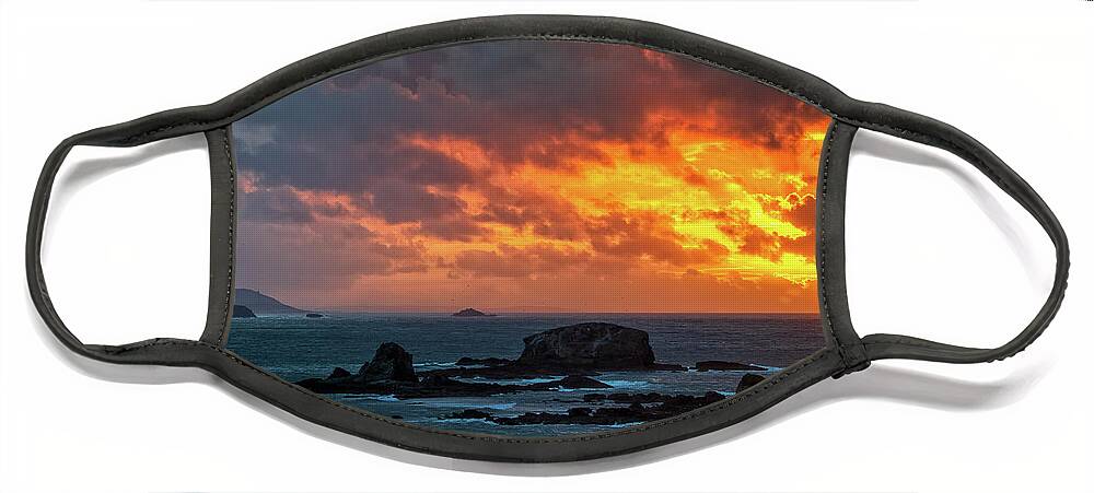 Stone Face Mask featuring the photograph Dramatic Sky of Fire over Miranda Islands at the Mouth of Ares Estuary La Coruna Galicia by Pablo Avanzini