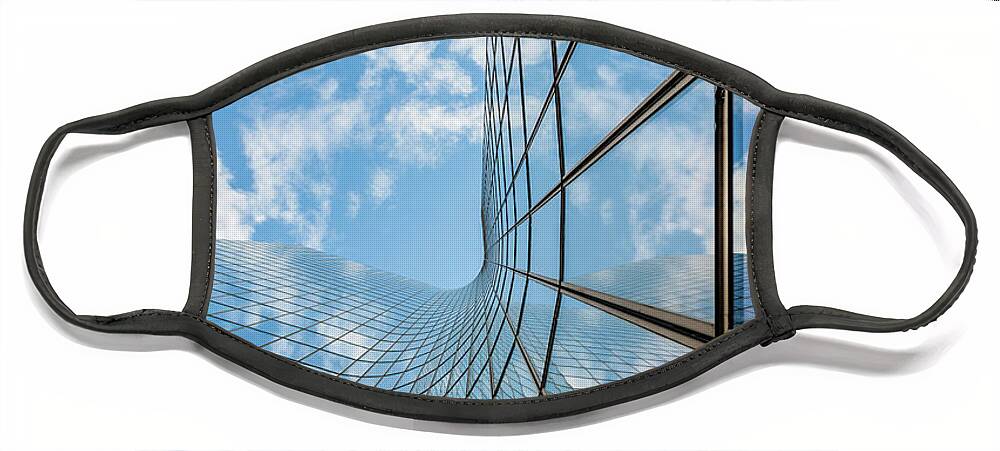 Glass Face Mask featuring the photograph Glass curved building and blue sky by Philippe Lejeanvre