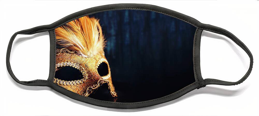 Mask Face Mask featuring the photograph Golden Venetian mask on dark blue background by Jelena Jovanovic