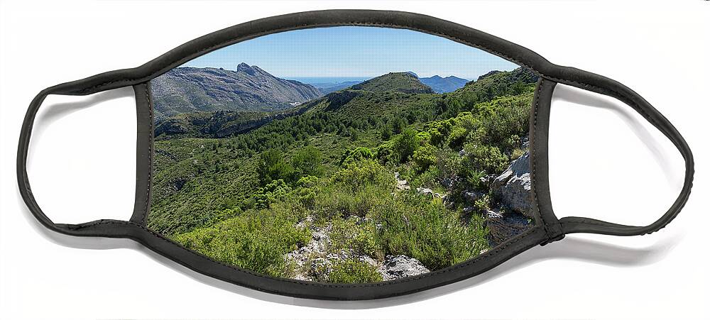 Mountain Face Mask featuring the photograph Green mountain landscape and the rock Cavall Verd by Adriana Mueller