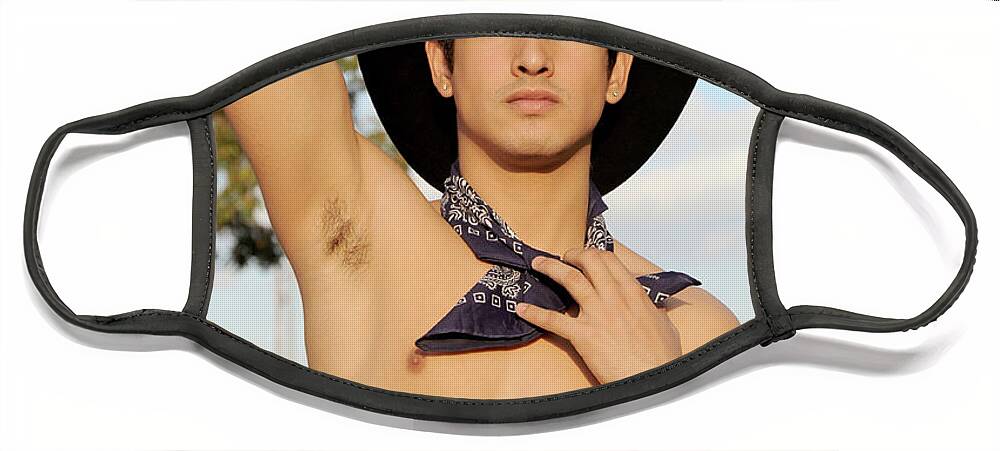 Body Face Mask featuring the photograph Handsome hispanic cowboy is wearing a black cowboy hat by Gunther Allen