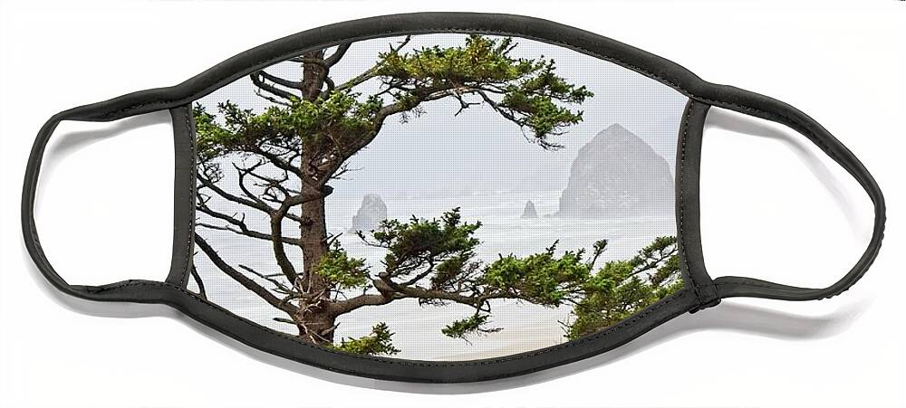 West Face Mask featuring the photograph Haystack Rock on Cannon Beach by Loren Gilbert