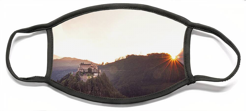 Reconstruction Face Mask featuring the photograph Hohenwerfen Castle at sunset by Vaclav Sonnek