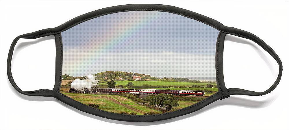 Weybourne Face Mask featuring the photograph Norfolk steam train with Weybourne windmill and rainbow by Simon Bratt
