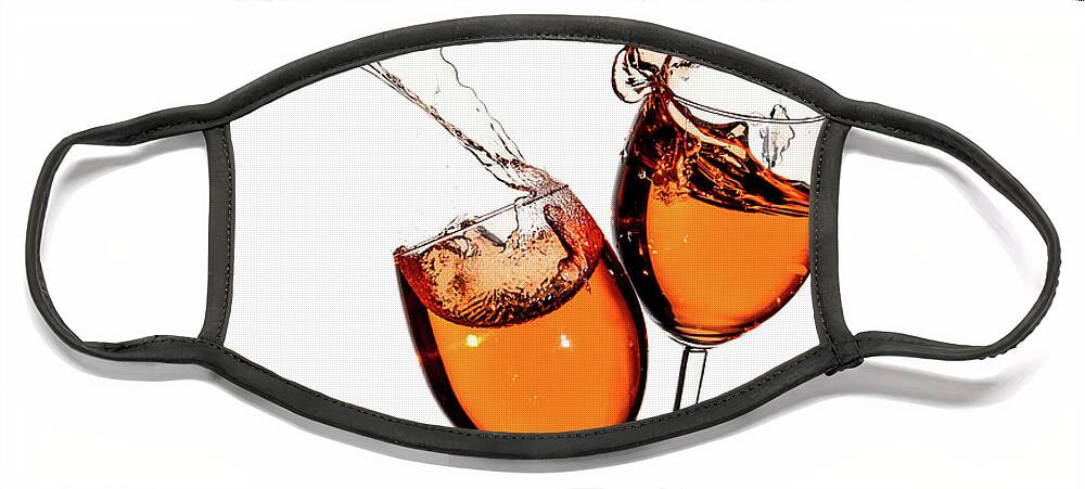 Alcohol Face Mask featuring the photograph Red wine in glasses with splashes on a white background isolated by Michalakis Ppalis