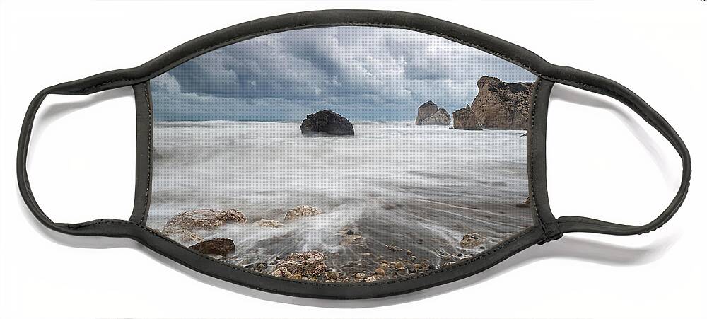 Seascape Face Mask featuring the photograph Seascape with windy waves during storm weather at the a rocky co by Michalakis Ppalis