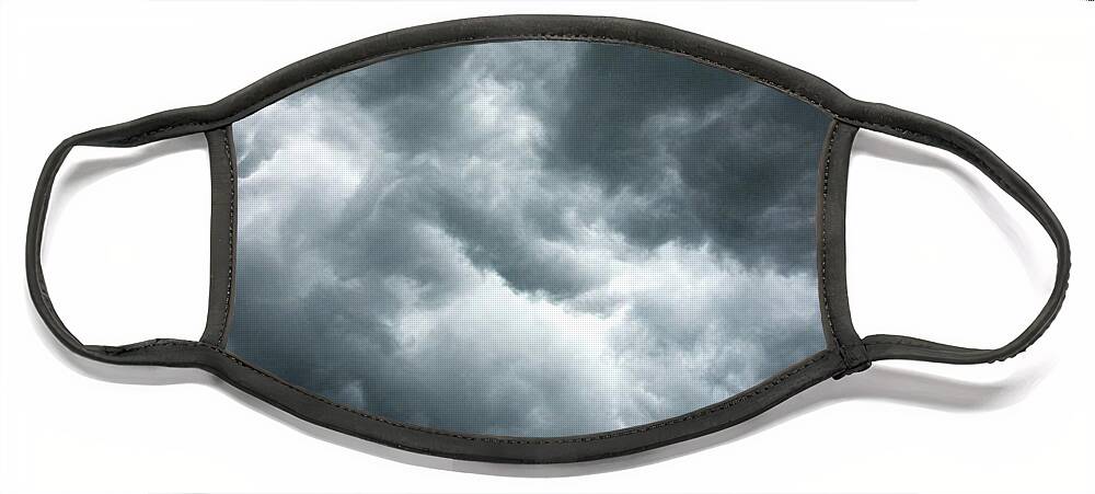 Clouds Face Mask featuring the photograph Stormy clouds in the sky. by Bernhard Schaffer