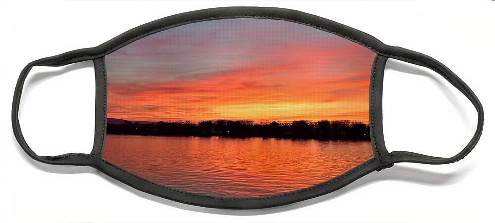 Nature Face Mask featuring the photograph Sunset draped in vermilion over the river by Leonida Arte