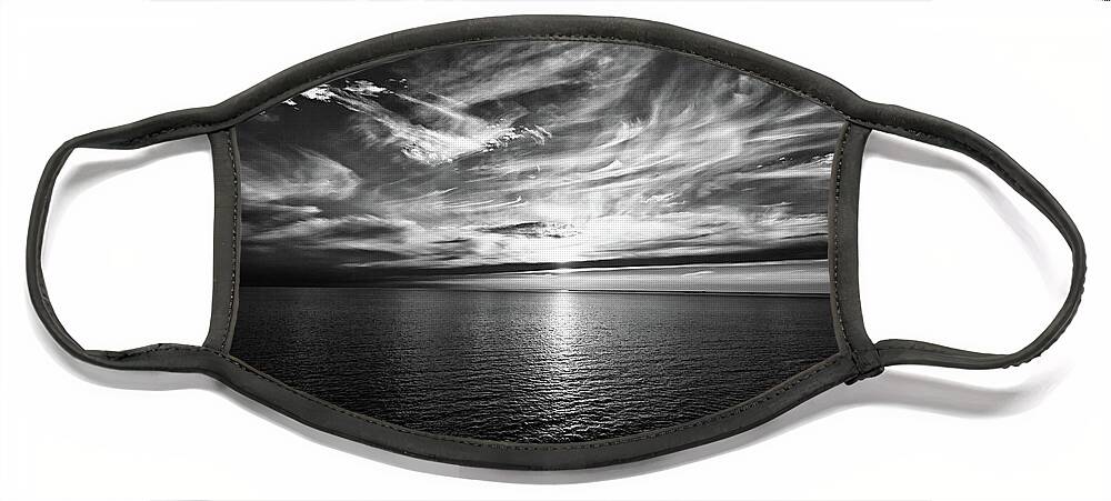 Sunset Face Mask featuring the photograph Sunset on the horizon at sea by Bernhard Schaffer