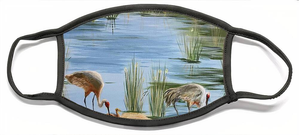 Sandhill Cranes Face Mask featuring the painting Tending the baby by Sue Dinenno