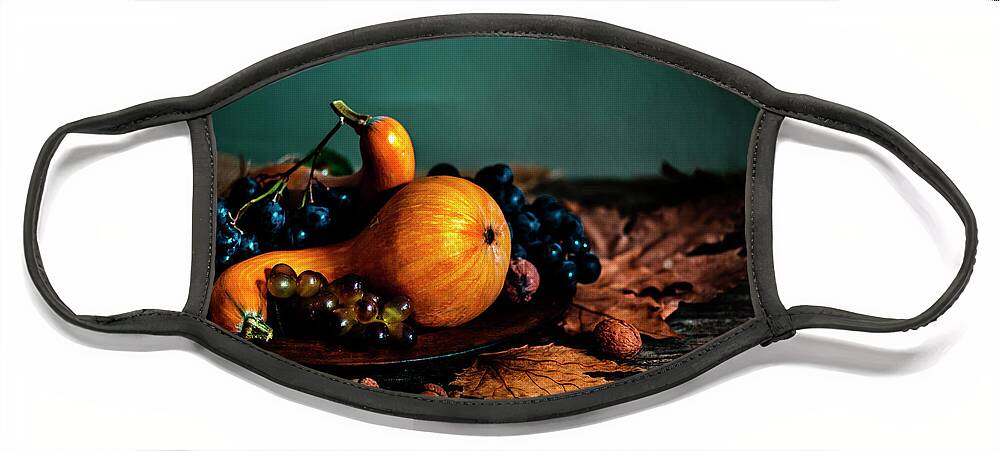 Thanksgiving Face Mask featuring the photograph Thanksgiving composition with autumn fruit in wooden plate by Jelena Jovanovic