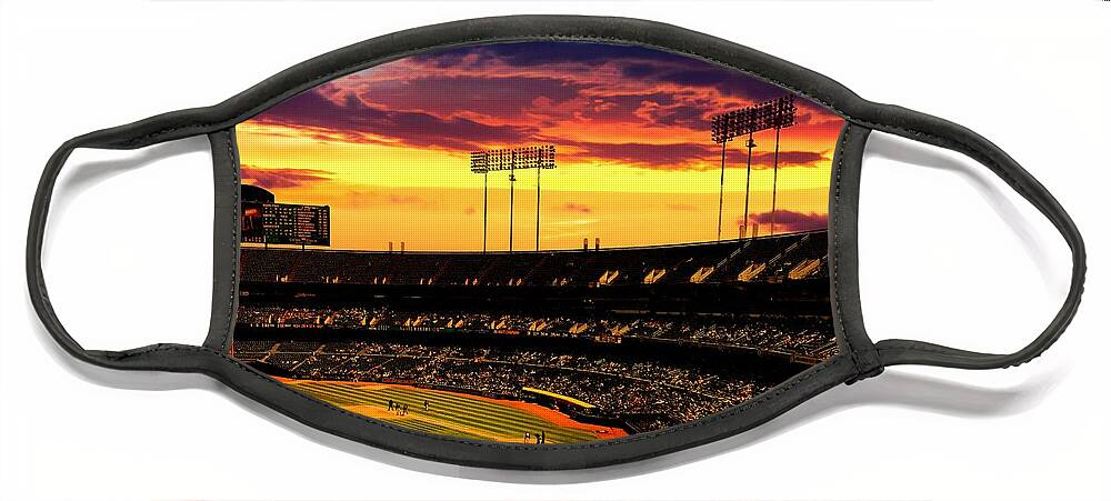 Oakland Face Mask featuring the digital art The Oakland-Alameda County Coliseum in sunset light by Nicko Prints
