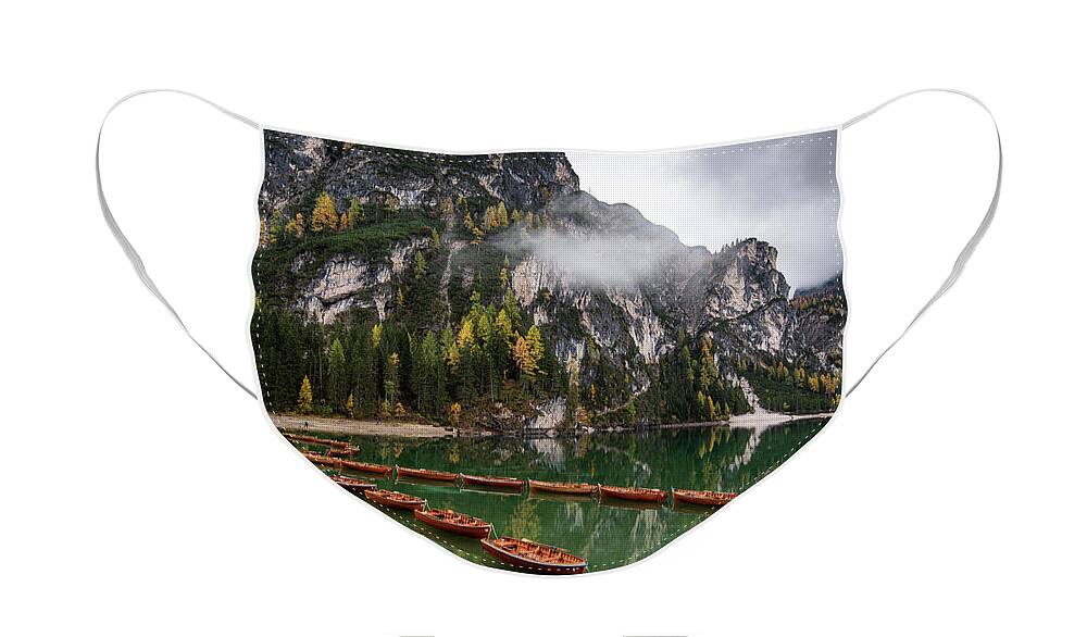 Lago Di Braies Face Mask featuring the photograph Wooden boats on the peaceful lake. Lago di braies, Italy by Michalakis Ppalis