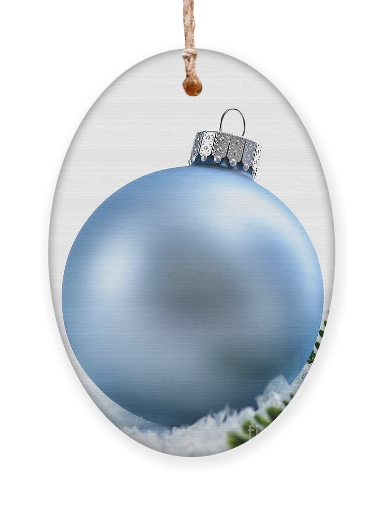 Christmas Ornament featuring the photograph Blue Christmas bauble 1 by Elena Elisseeva