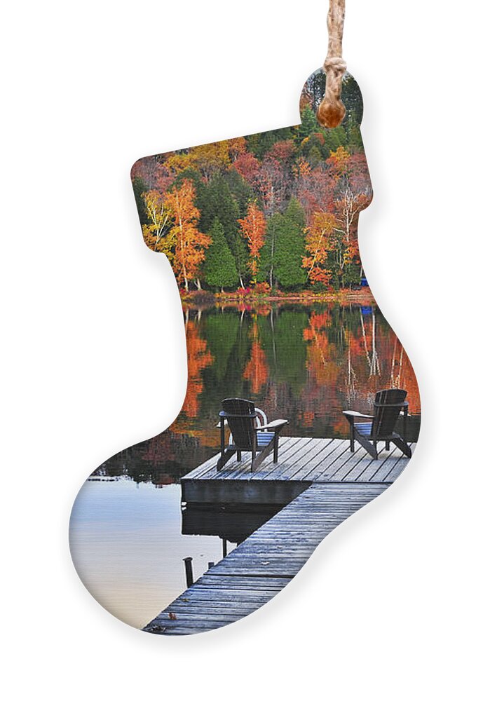 Lake Ornament featuring the photograph Wooden dock with chairs on autumn lake by Elena Elisseeva