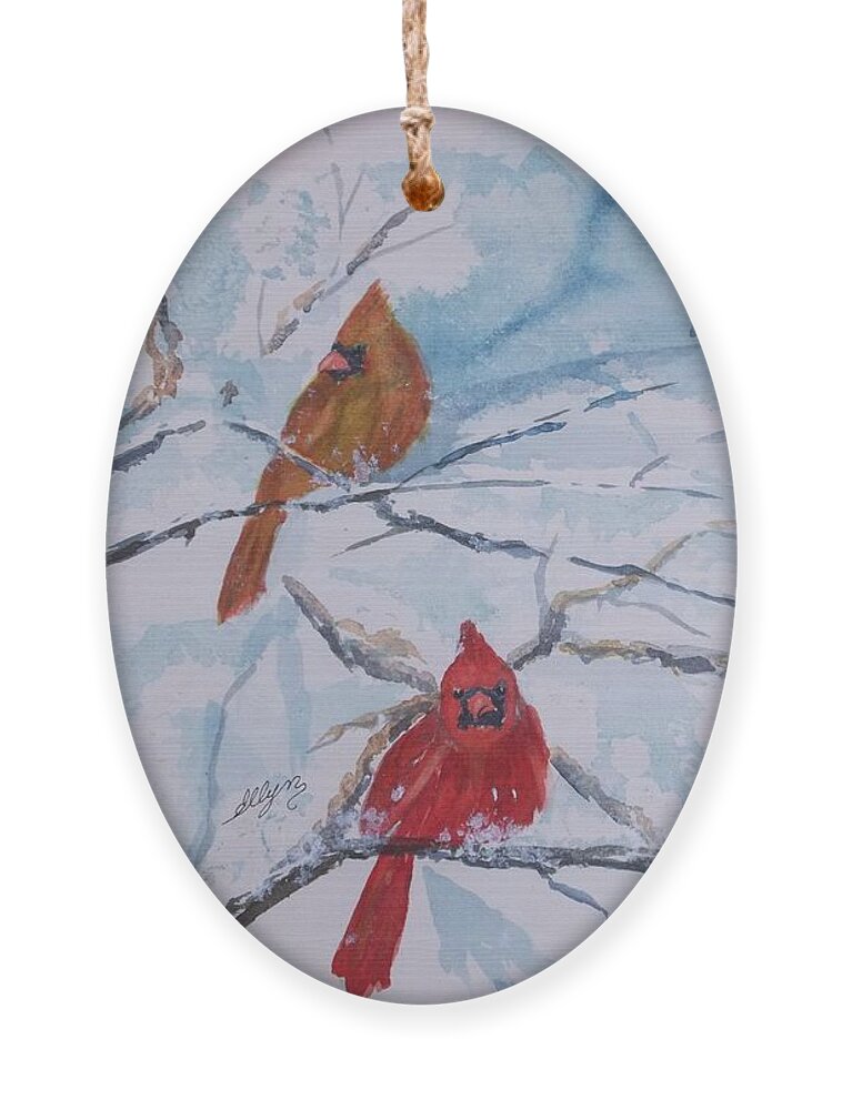 Cardinals Ornament featuring the painting A trio of Cardinals Nestled in Snow Covered Branches by Ellen Levinson