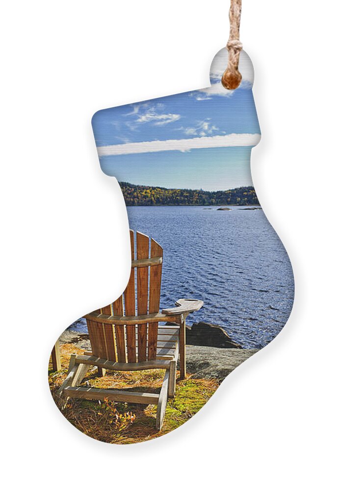 Chairs Ornament featuring the photograph Adirondack chairs at lake shore 1 by Elena Elisseeva