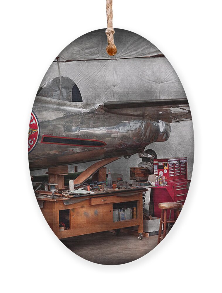 Plane Ornament featuring the photograph Airplane - The repair hanger by Mike Savad