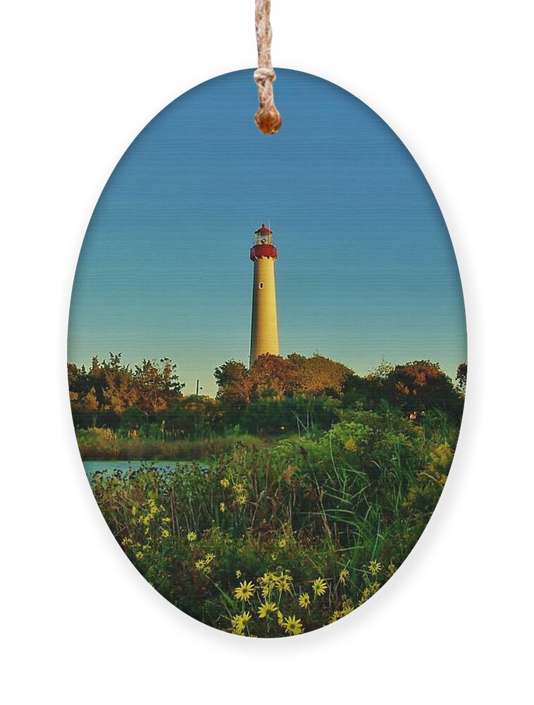 Ocean Ornament featuring the photograph Cape May Lighthouse Above the Flowers by Ed Sweeney