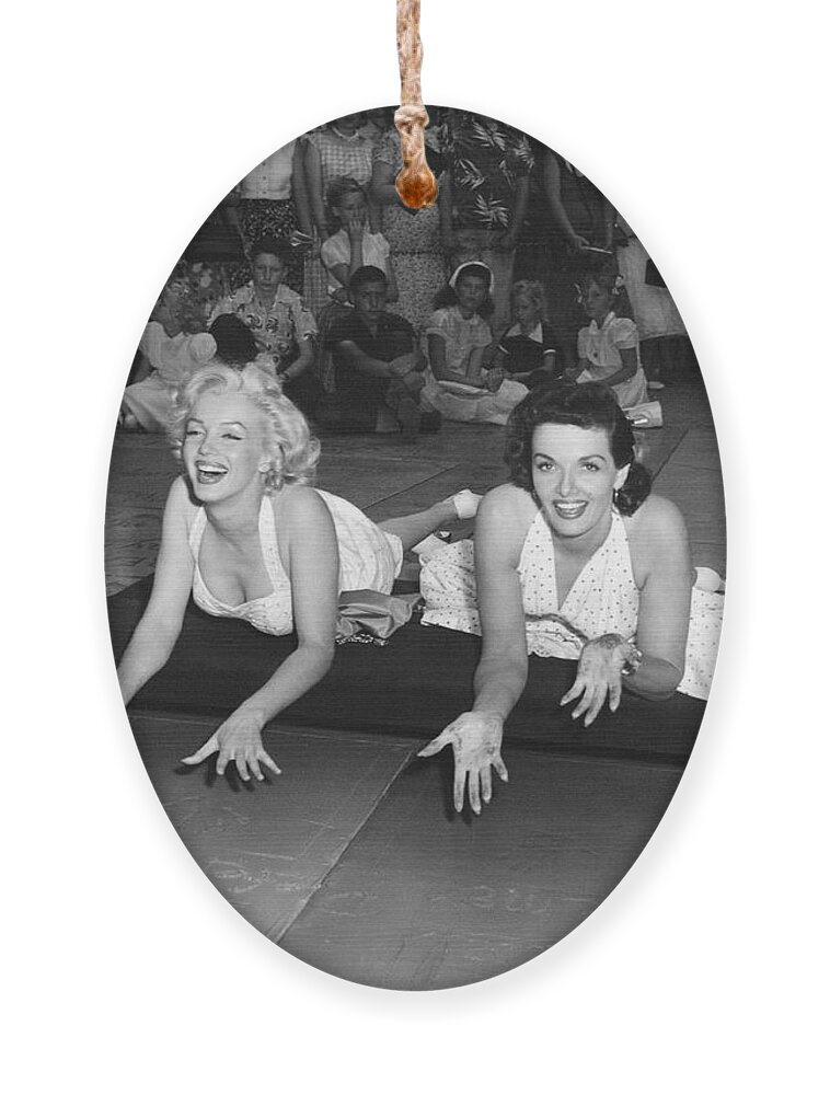 1950's Ornament featuring the photograph Marilyn Monroe And Jane Russell by Underwood Archives