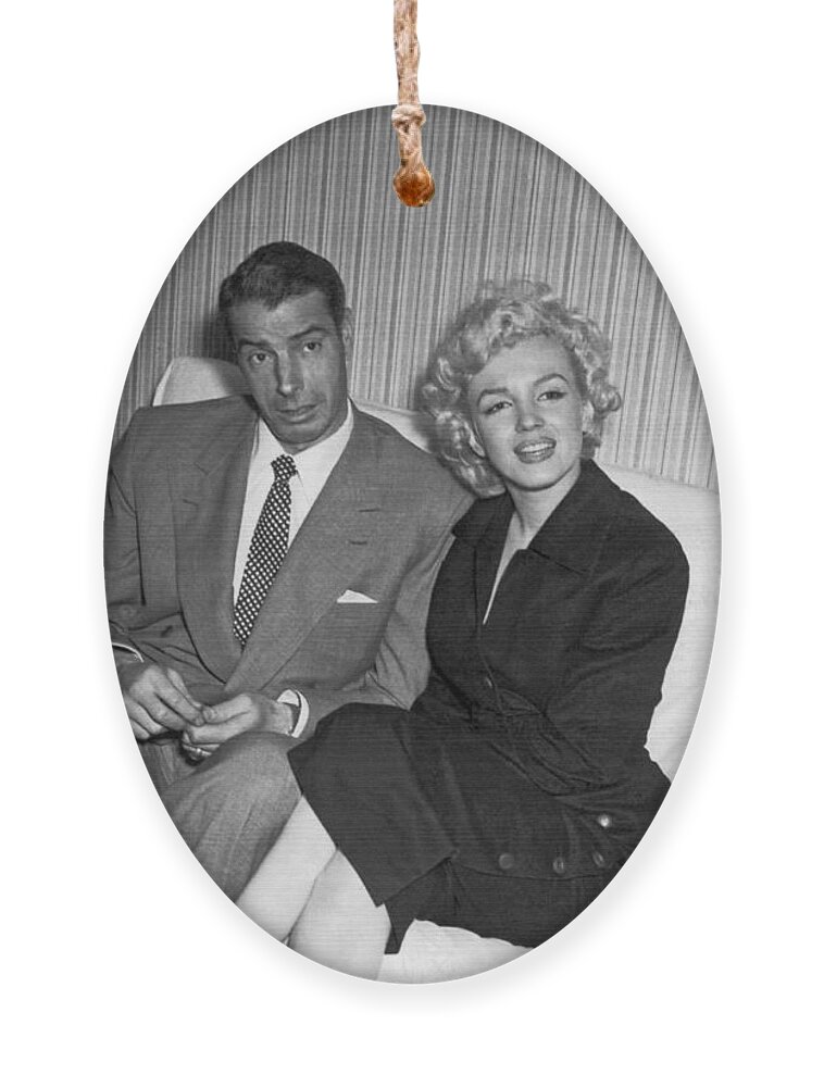 1954 Ornament featuring the photograph Marilyn Monroe And Joe DiMaggio by Underwood Archives