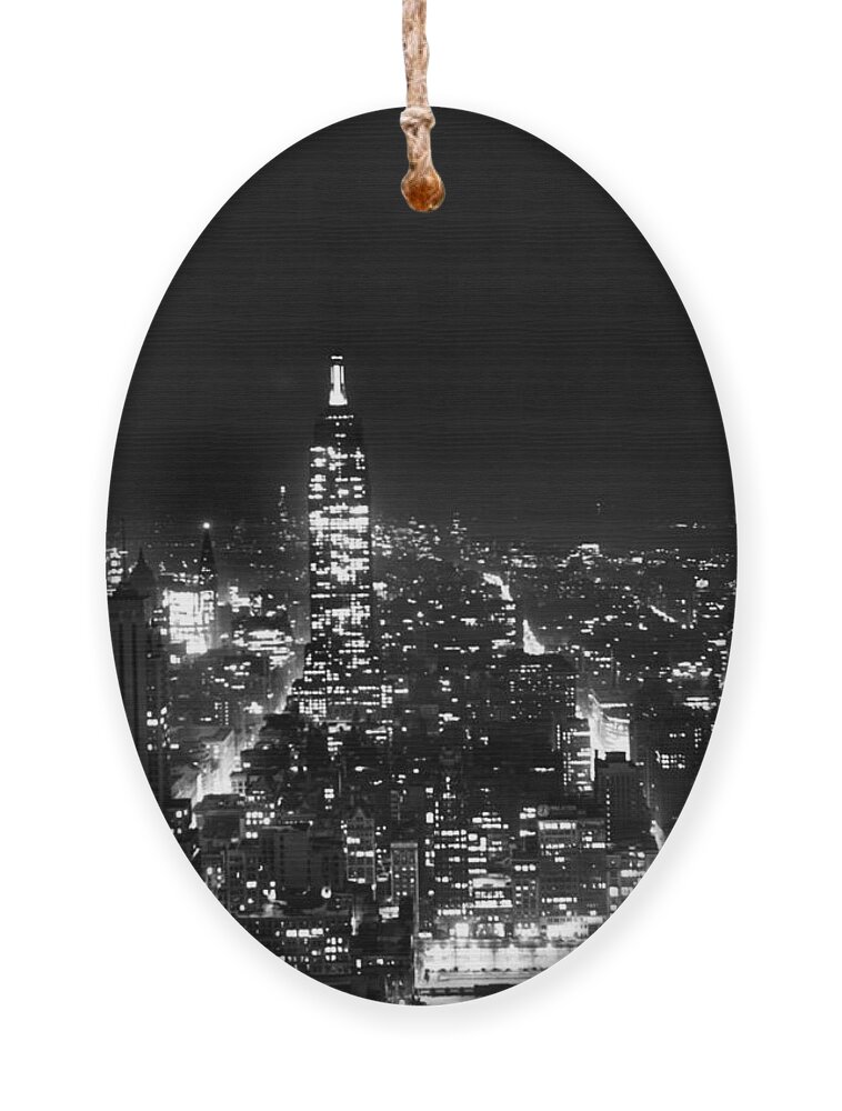 1945 Ornament featuring the photograph Midtown Manhattan At Night by Underwood Archives