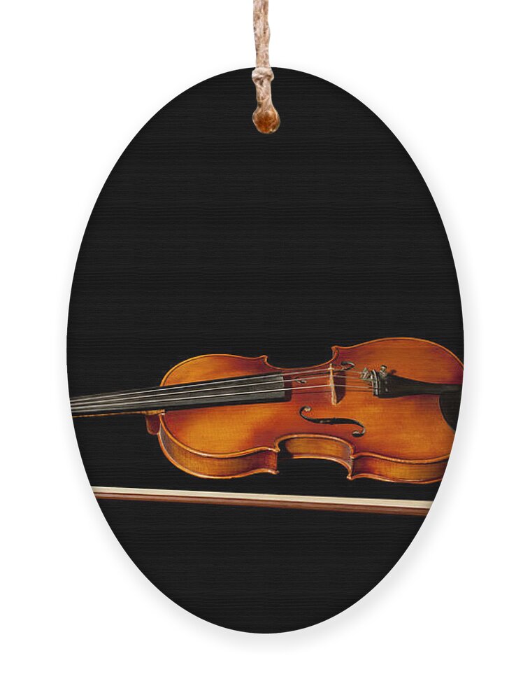 Violin Ornament featuring the photograph My old fiddle and bow by Torbjorn Swenelius