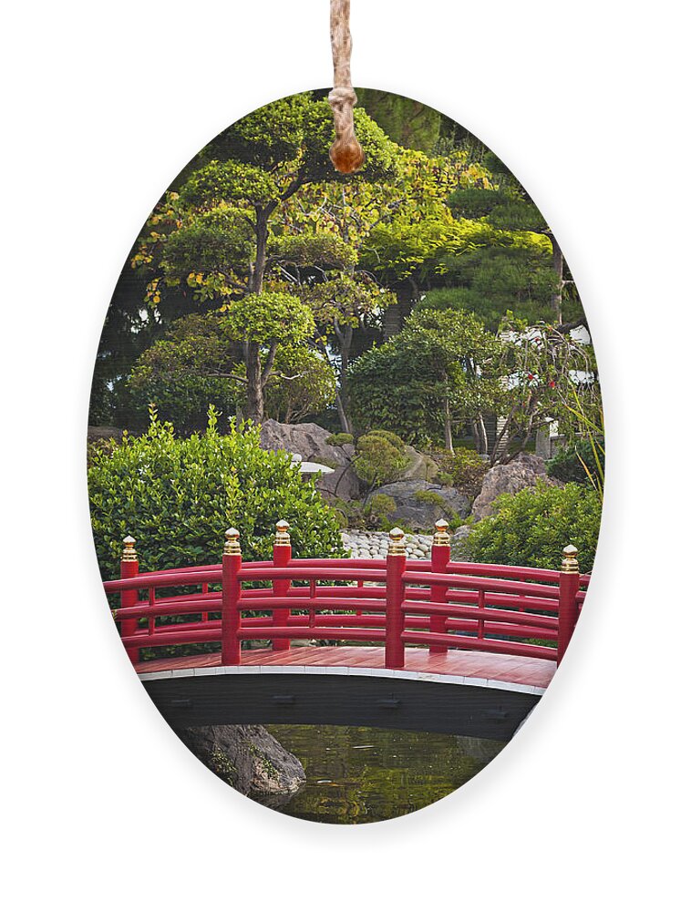Japanese Ornament featuring the photograph Red bridge in Japanese garden by Elena Elisseeva