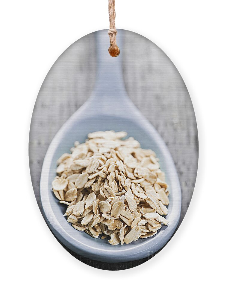 Oats Ornament featuring the photograph Rolled oats by Elena Elisseeva