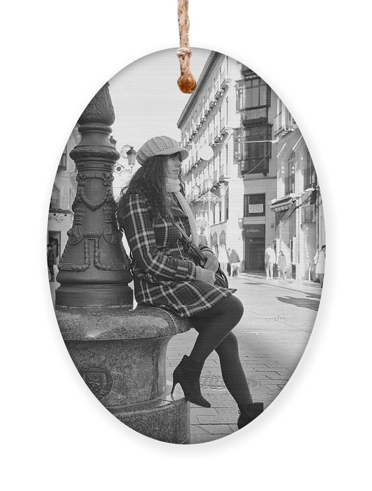 Girl Ornament featuring the photograph Waiting in this Spanish street by Pablo Lopez