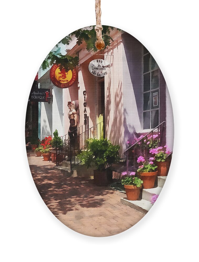 Alexandria Ornament featuring the photograph Alexandria VA - Street With Art Gallery and Tobacconist by Susan Savad