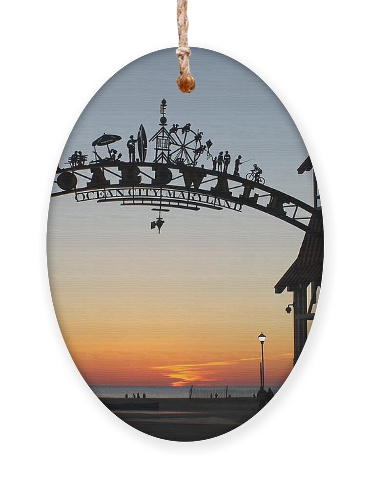 Sunrise Ornament featuring the photograph Sun Reflecting on Clouds Ocean City Boardwalk Arch by Robert Banach
