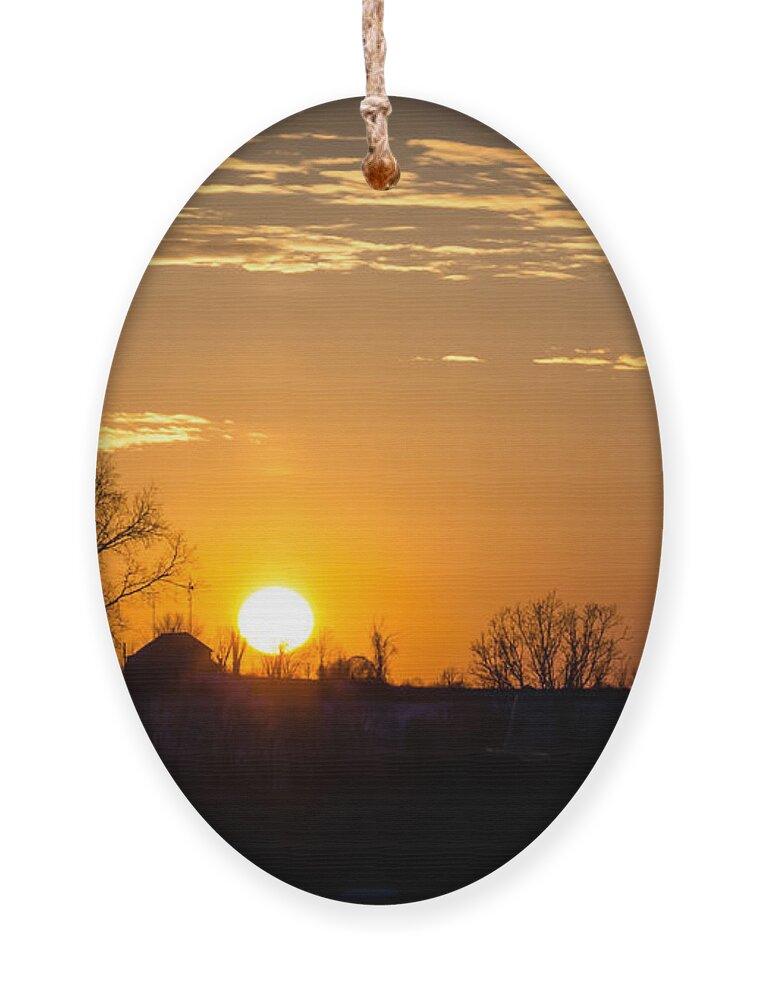 Sunset Ornament featuring the photograph Sunset Over the Distant Farm by Holden The Moment