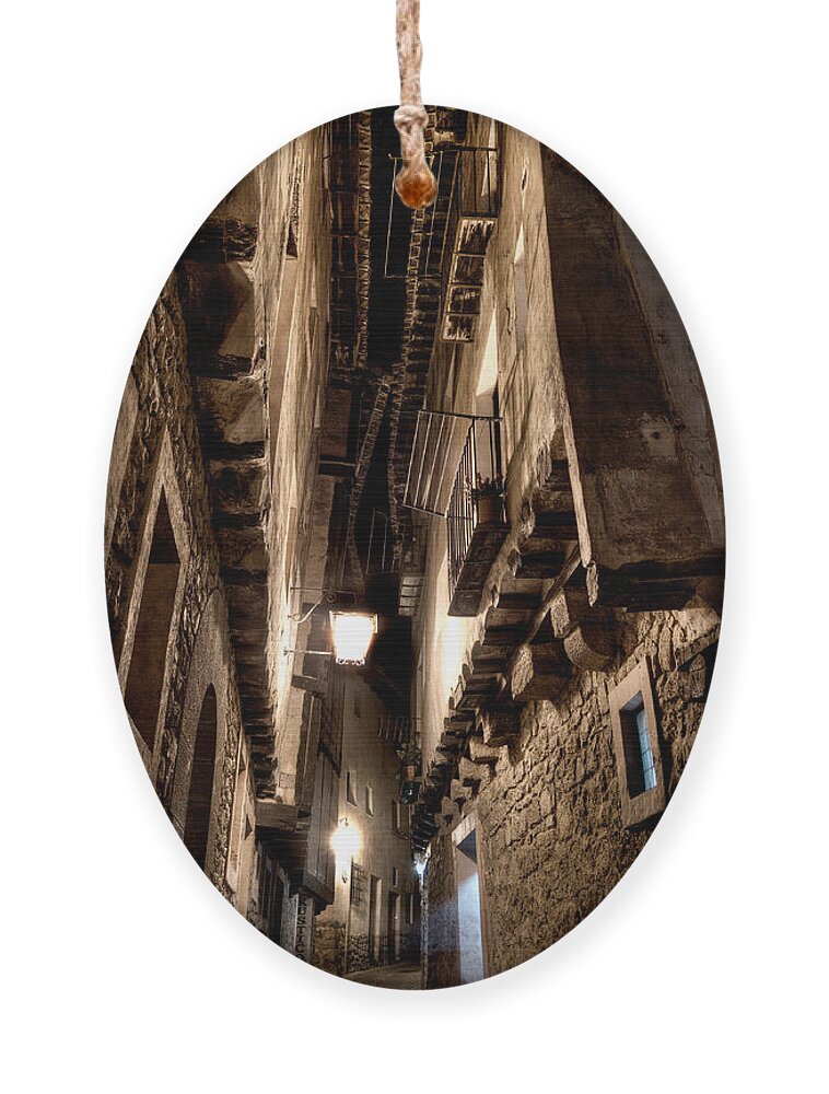 Narrow Street Ornament featuring the photograph Narrow street in Albarracin by Weston Westmoreland