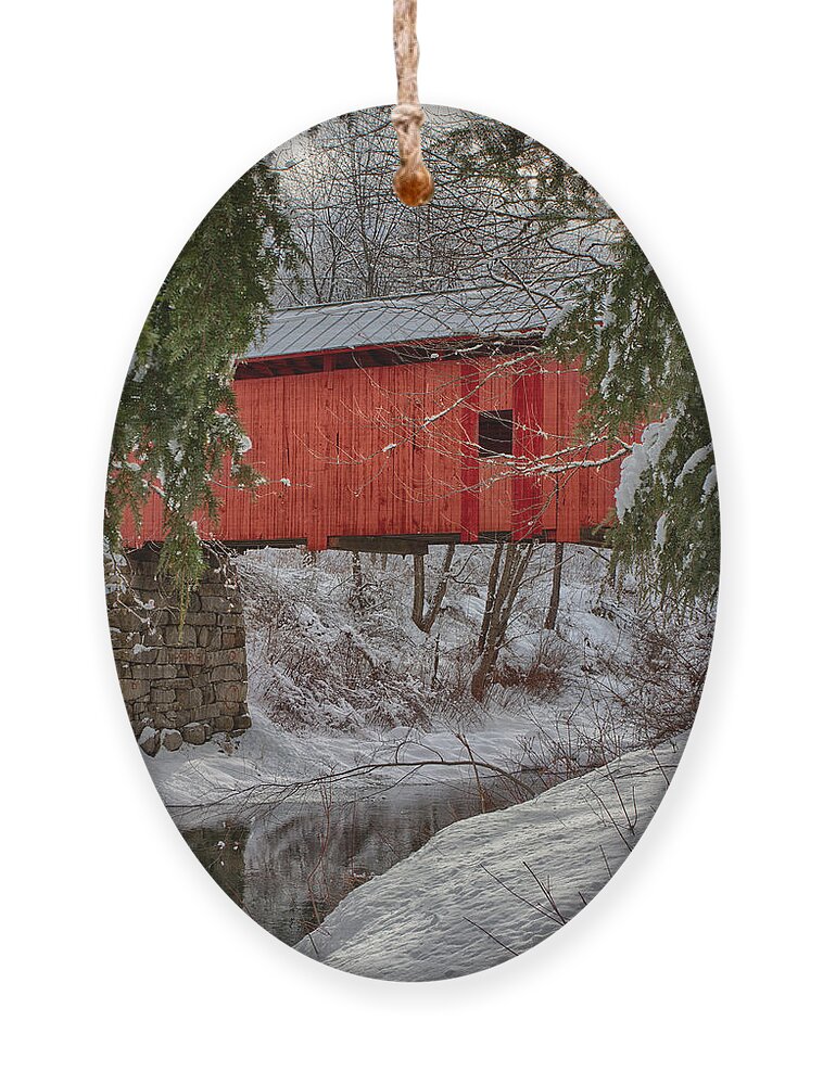 Covered Bridge Ornament featuring the photograph View through the boughs of Vermont covered bridge by Jeff Folger