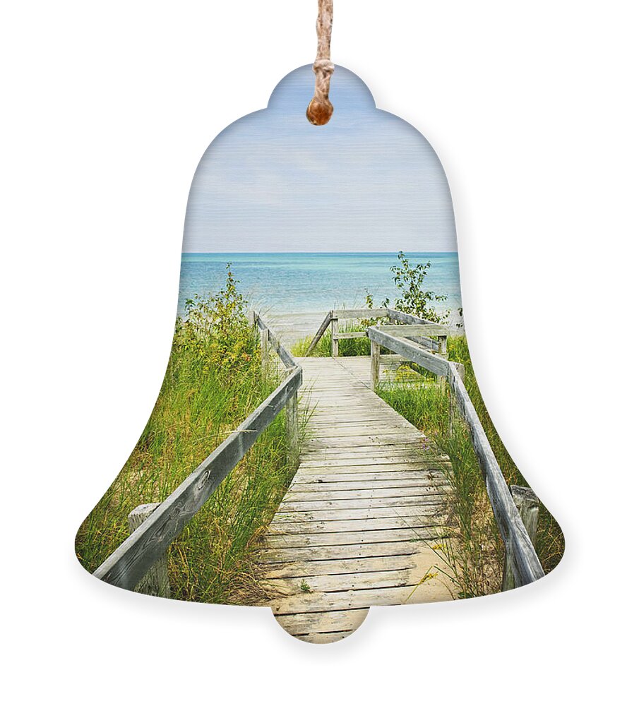 Beach Ornament featuring the photograph Wooden walkway over dunes at beach by Elena Elisseeva