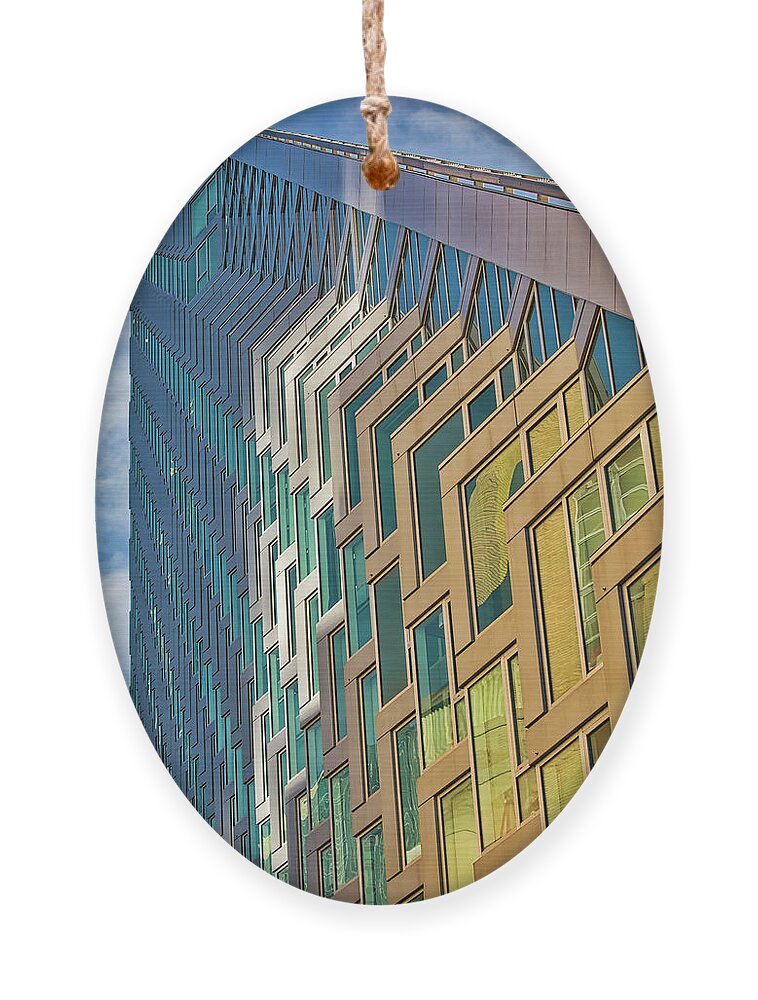 625 West 57th Street Ornament featuring the photograph Upward View to West 57 ST NYC BW by Susan Candelario