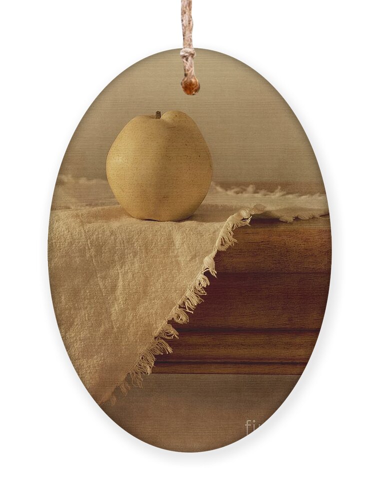 Dining Room Ornament featuring the photograph Apple Pear On A Table by Priska Wettstein