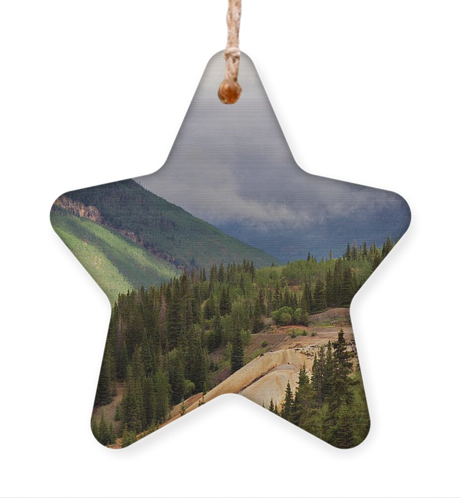 Colorado Ornament featuring the photograph As The Clouds Roll In by Lana Trussell