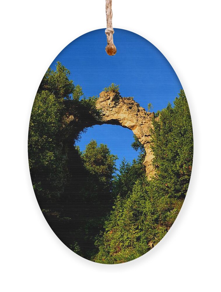 Mackinac Island Ornament featuring the photograph Beneath Arch Rock by Keith Stokes