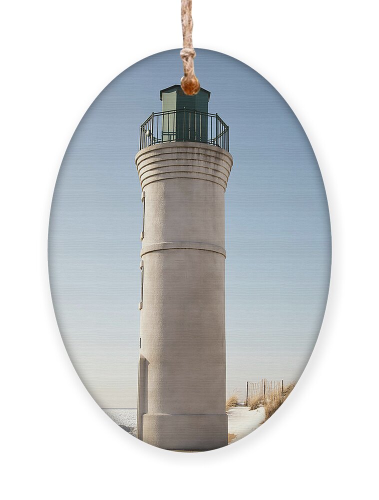 America Ornament featuring the photograph Exterior of Robert H Manning Lighthouse, Empire, Michigan in win by Karen Foley