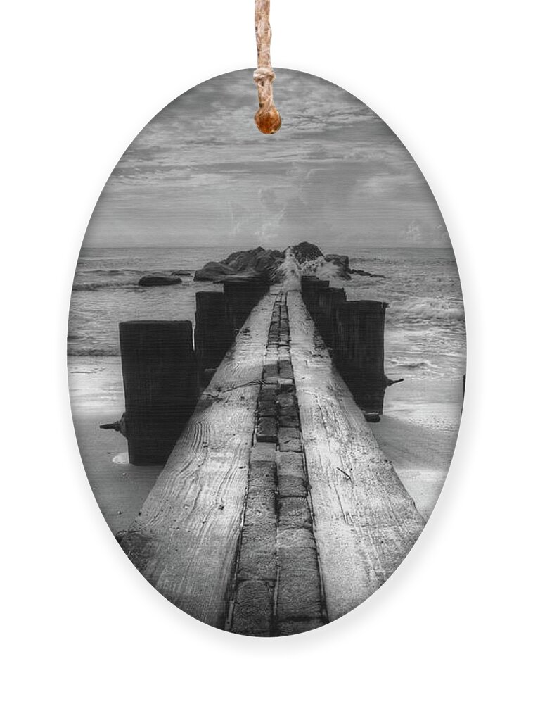 Folly Beach Pilings Ornament featuring the photograph Folly Beach Pilings Charleston South Carolina In Black and White by Carol Montoya