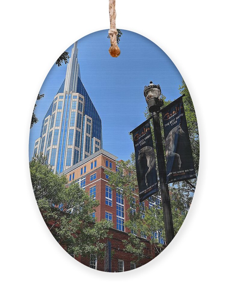 Nasheville Tennessee At And T Building Ornament featuring the photograph Nashville Tennessee AT And T Building by Carol Montoya
