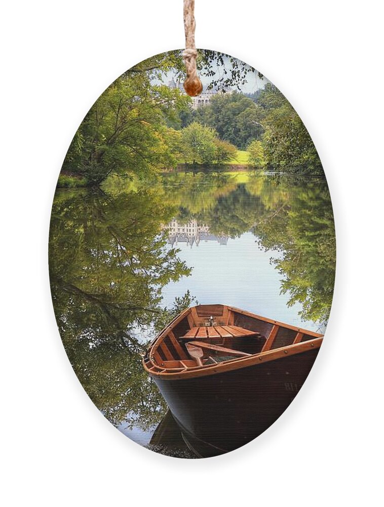 Lagoon Ornament featuring the photograph Orvis Rowboat And Biltmore Reflection II by Carol Montoya