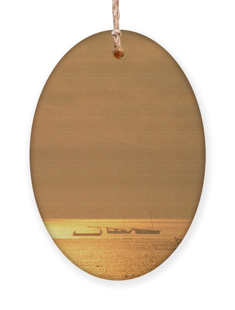 Sunset Ornament featuring the photograph Raha Sunset by Werner Padarin