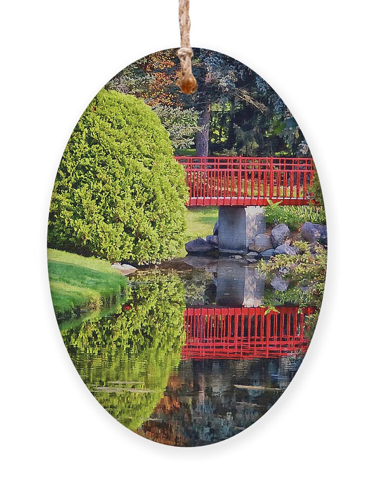 Red Bridge Ornament featuring the photograph Red Bridge at Dow Gardens by Peg Runyan